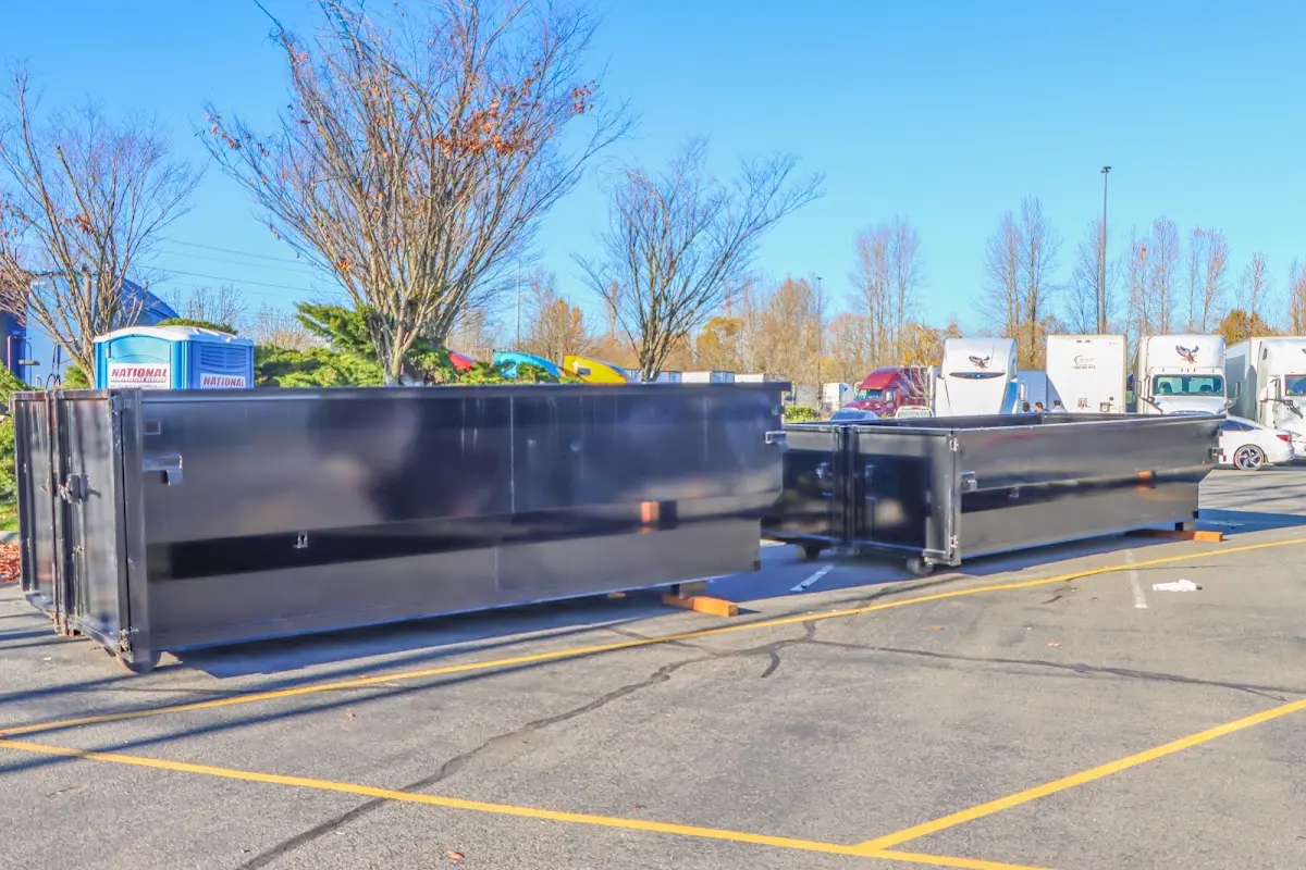 Professional dumpster rental service with roll-off container on residential driveway in Agoura Hills